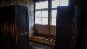 Wooden bed and lockers inside Sachsenhausen Memorial barracks