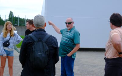 How can I plan a meaningful day trip to a concentration camp near Berlin?