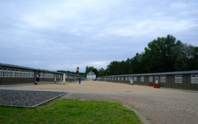 Why is it important to visit concentration camps in Berlin?